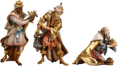 Three hand-carved wooden Three Kings figures in colorful traditional robes, holding gifts