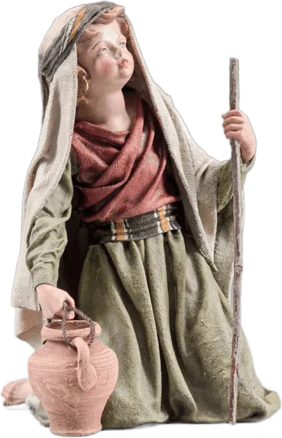 Hand-carved wooden boy kneeling figure with staff and jug, dressed in fabric robes