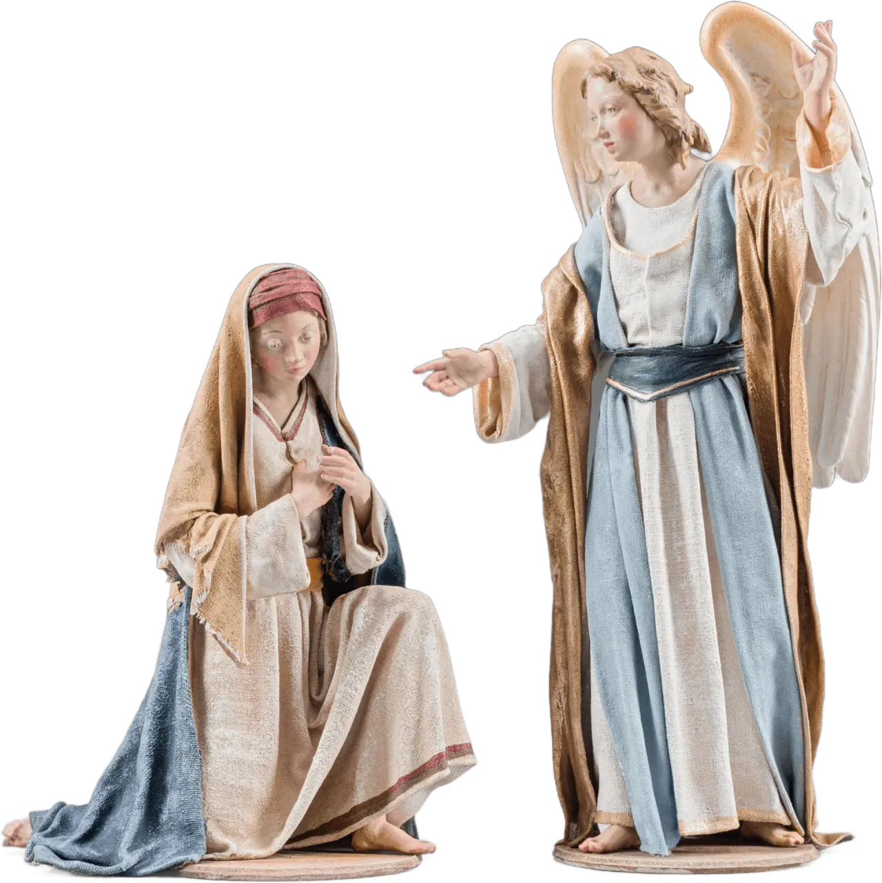 Hand-carved wooden Annunciation to Mary figures with angel and Mary draped in hardened fabrics, painted in soft colors