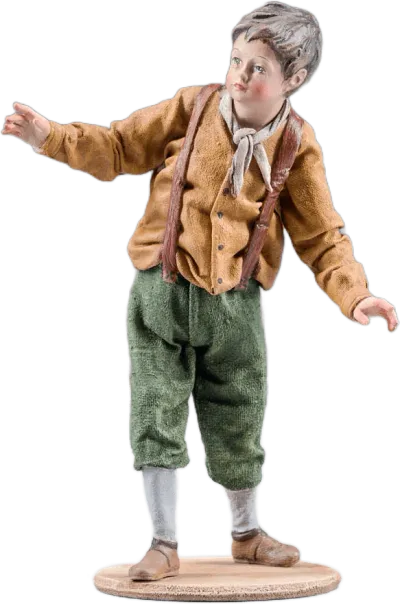 Hand-carved wooden Boy figure in brown jacket and green pants with fabric clothing