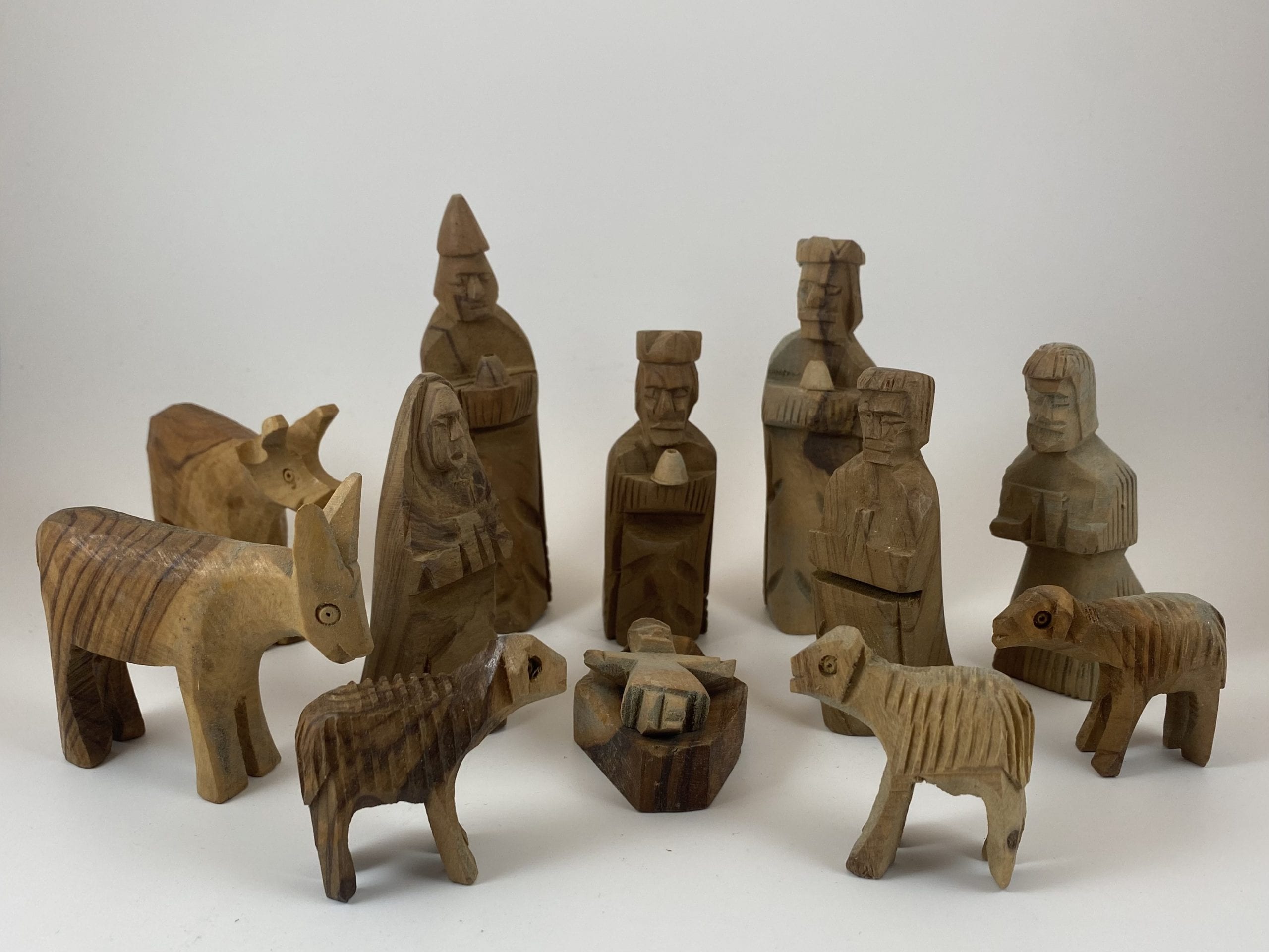 12-piece olive wood nativity set with rustic hand-carved figures including Holy Family, kings, shepherds, and animals