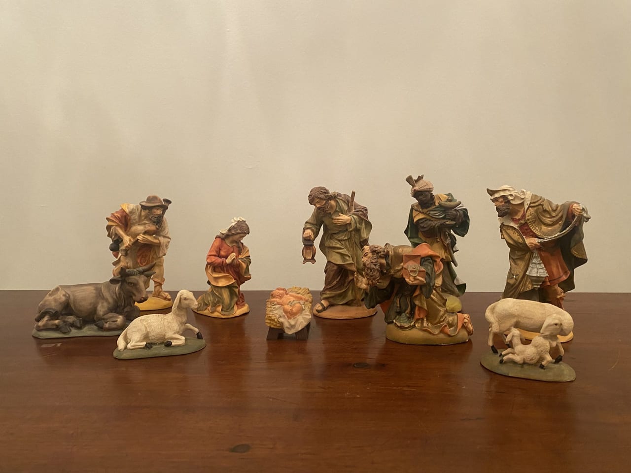 Ten-piece resin nativity set with Holy Family, Magi, Bagpiper, sheep, and ox, all hand-painted and standing about 6 inches tall
