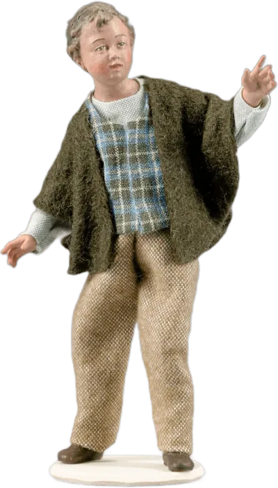 Hand-carved wooden Boy figure in fabric clothing, standing with arms slightly raised