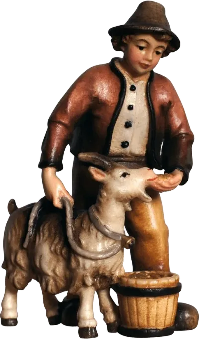Hand-carved and hand-painted wooden figure of a boy feeding a goat with a basket, brown jacket and hat